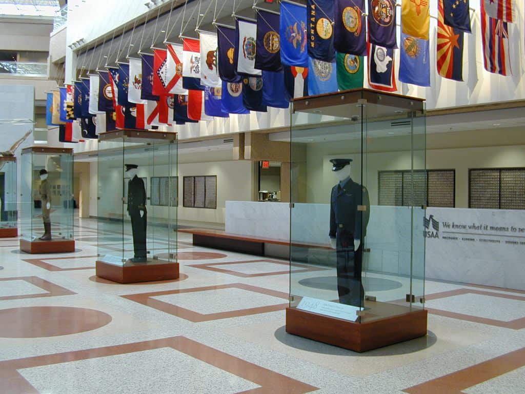 Pictured: USAA's lobby exhibit, which History Factory built for them. The lobby features the uniforms of members and employees to authenticate their stories.